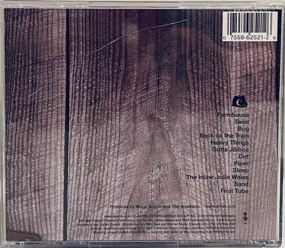 CD case with a wooden plank background and a track list.