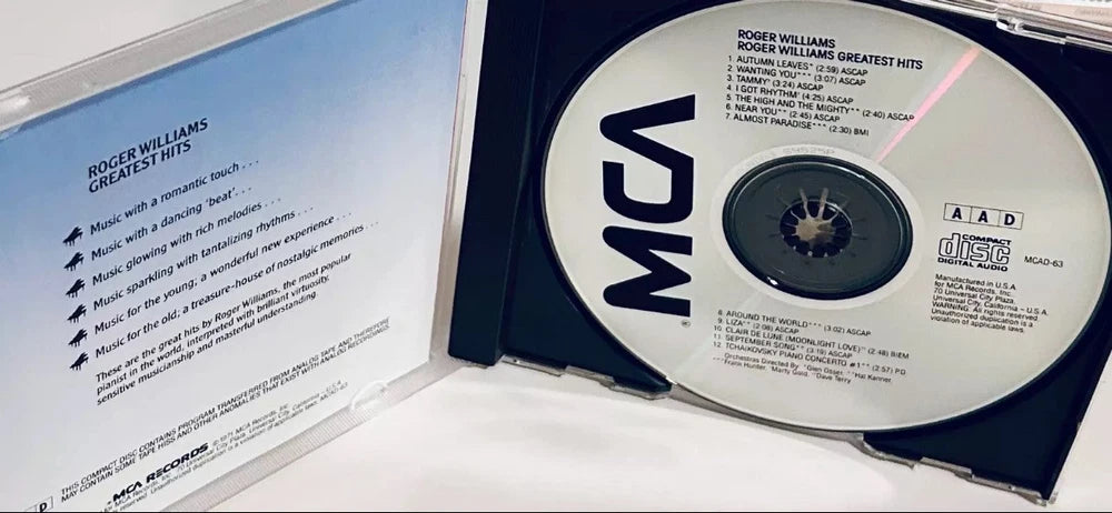 Open CD case for Roger Williams' "Greatest Hits" album with the disc visible.