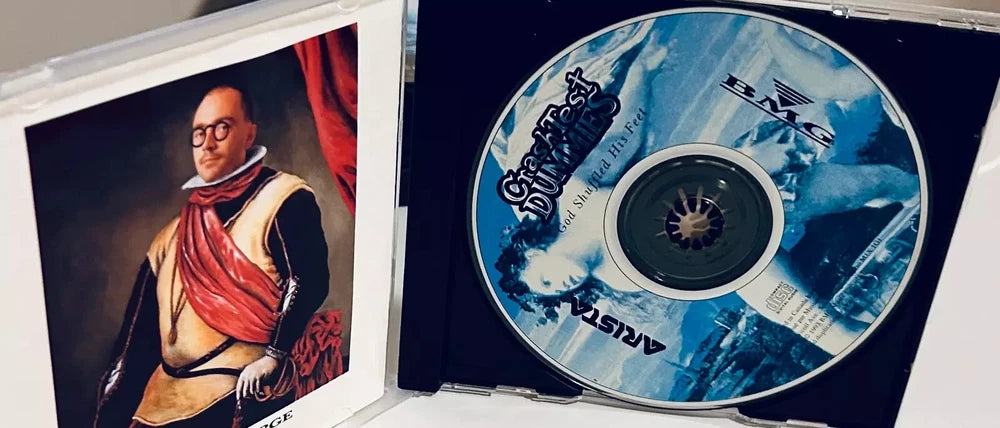 CD case with a portrait on the left and a Crash Test Dummies CD on the right.